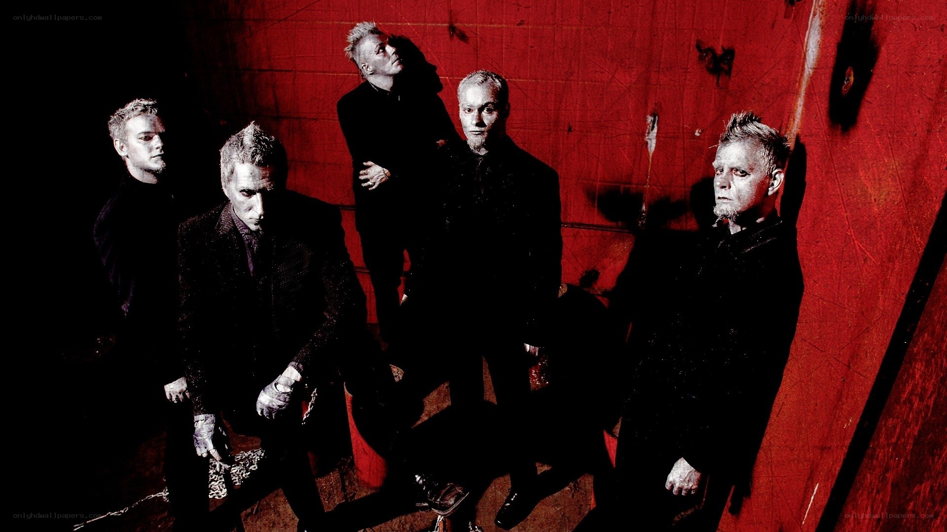 band members in red room