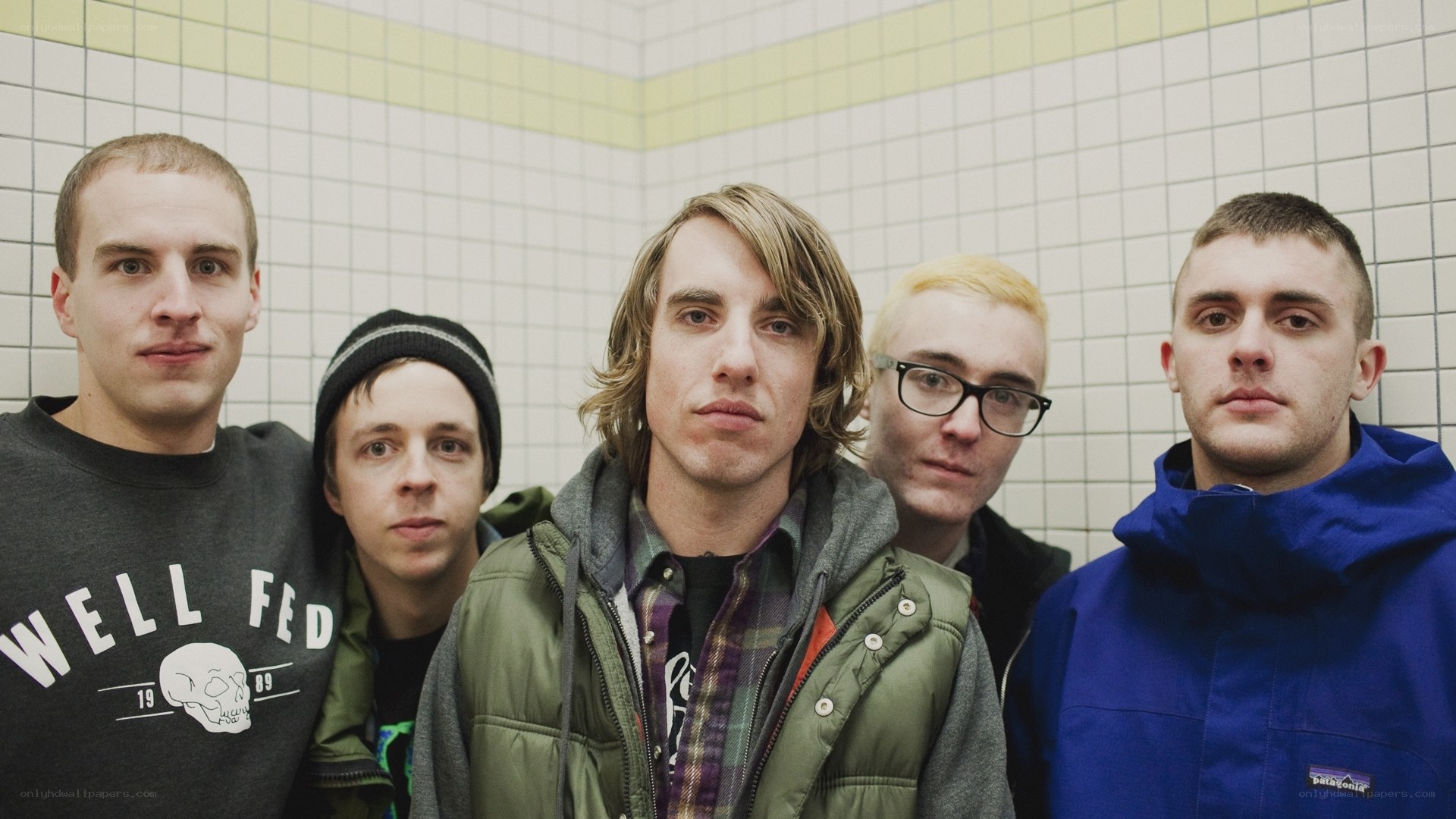 band members in tiled room