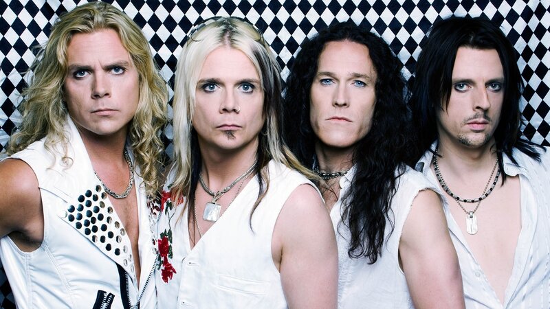 band members in white outfits