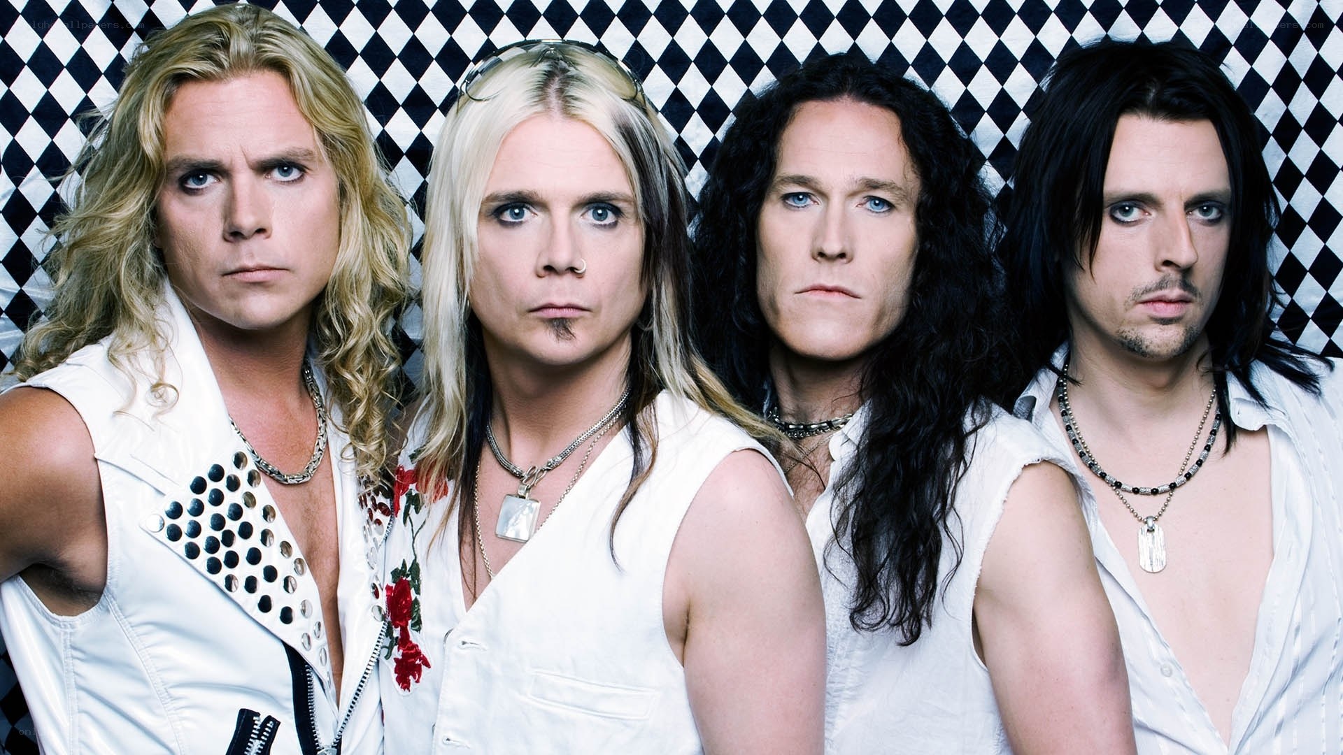 band members in white outfits