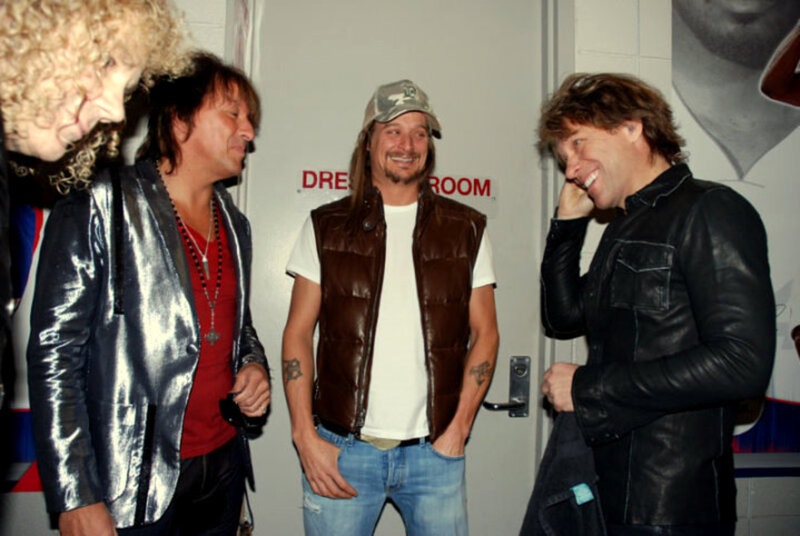 band members laughing backstage