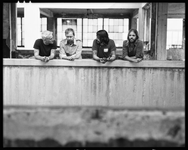 band members on a balcony