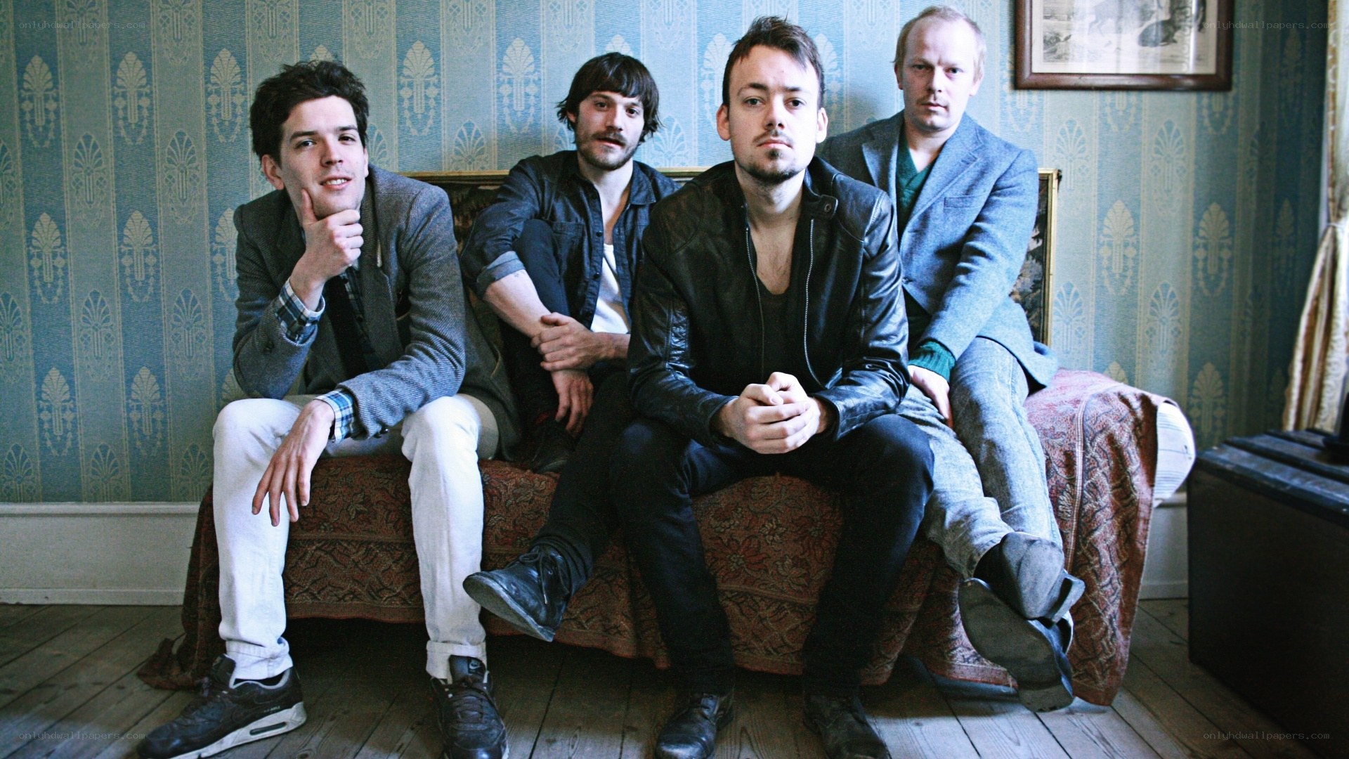 band members on a couch