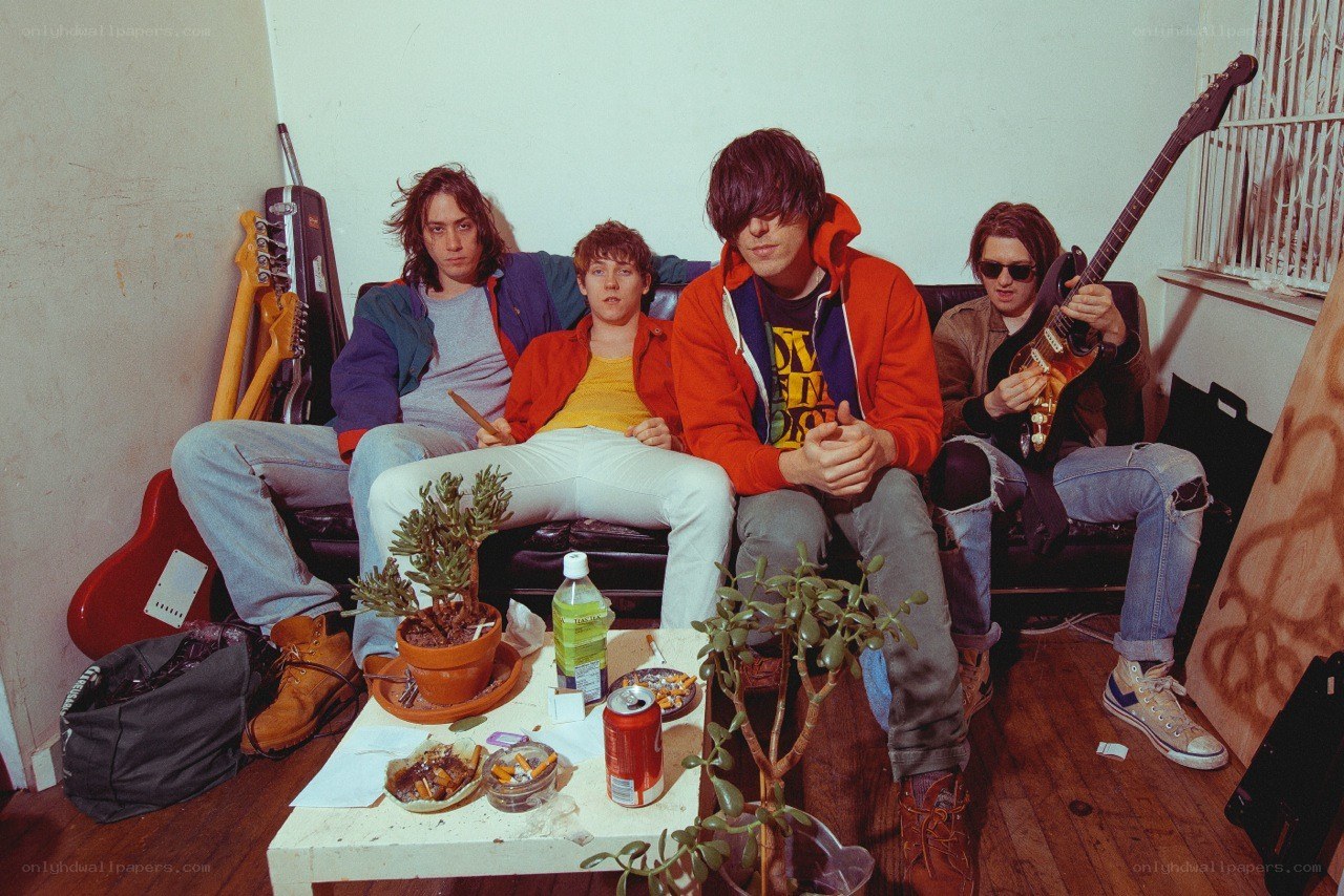 band members on a couch