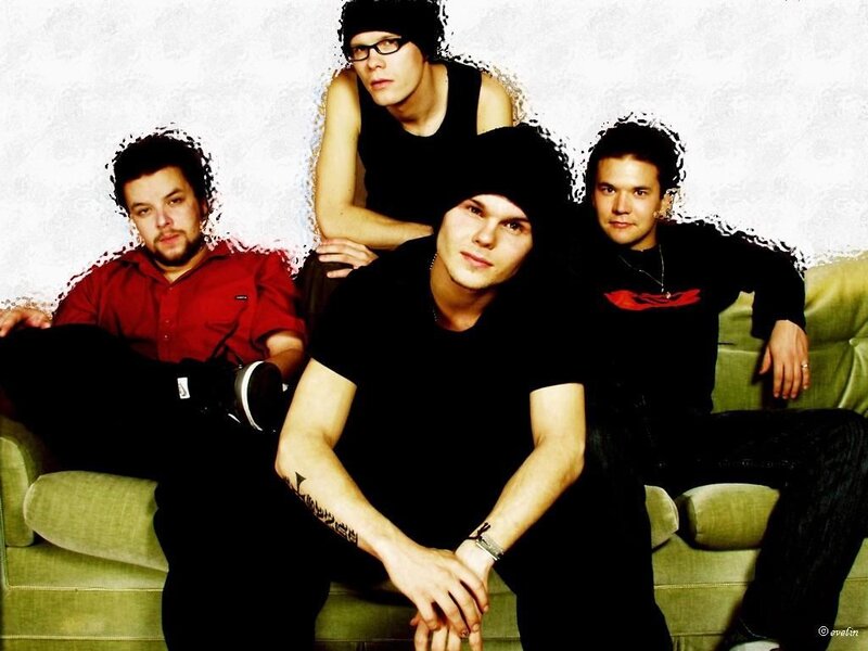 band members on a green couch