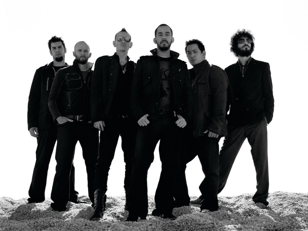 band members on a hill
