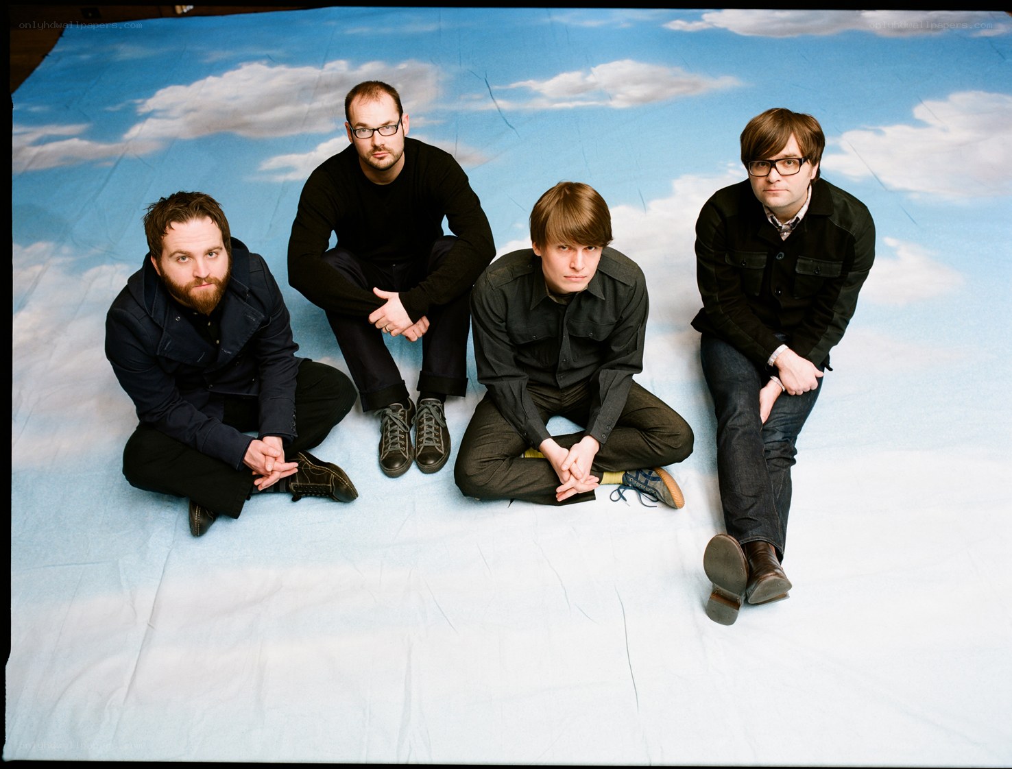 band members on a sky backdrop