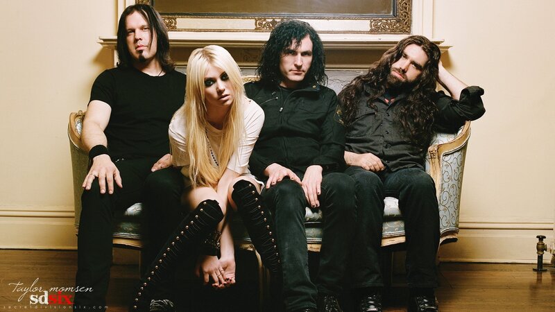 Band Members on Couch — Black, Serious