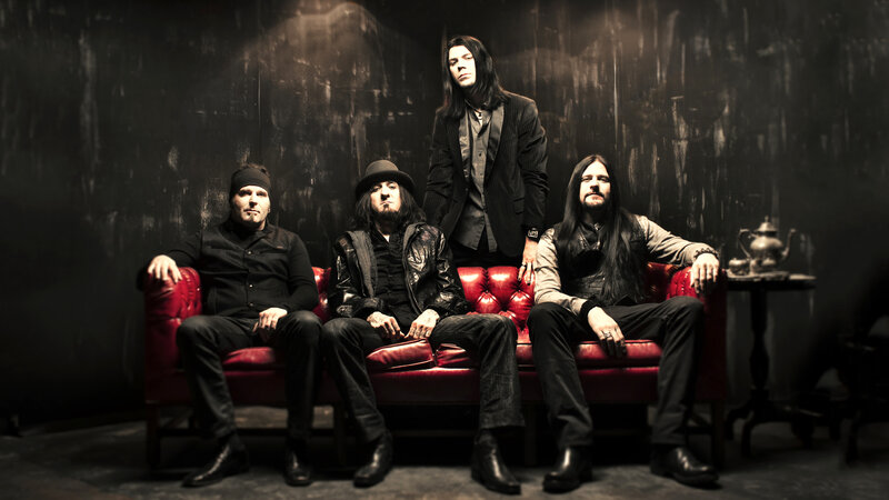 Band Members on Couch — Red