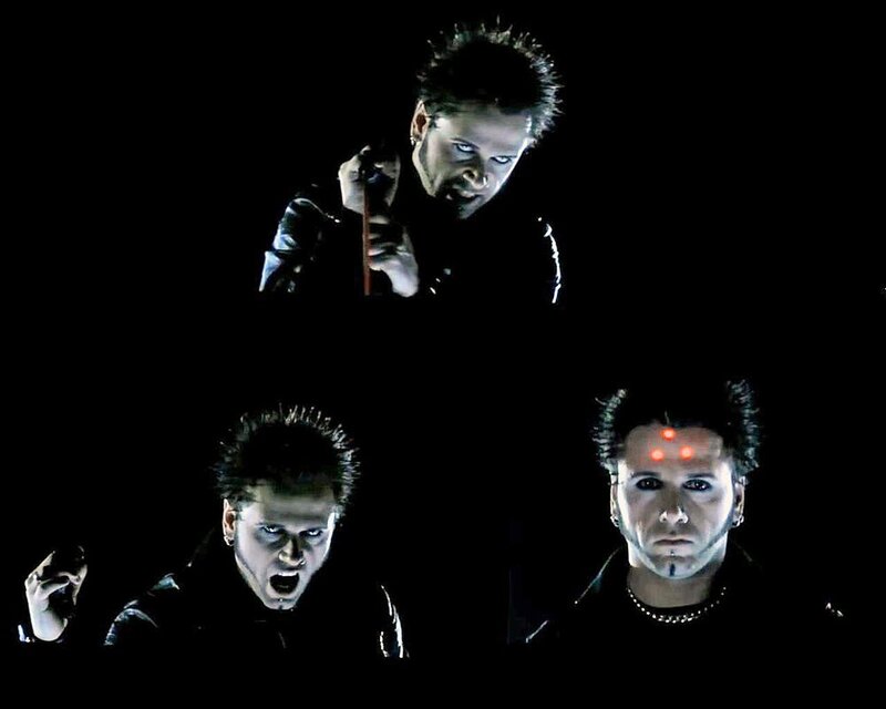 band members on dark stage