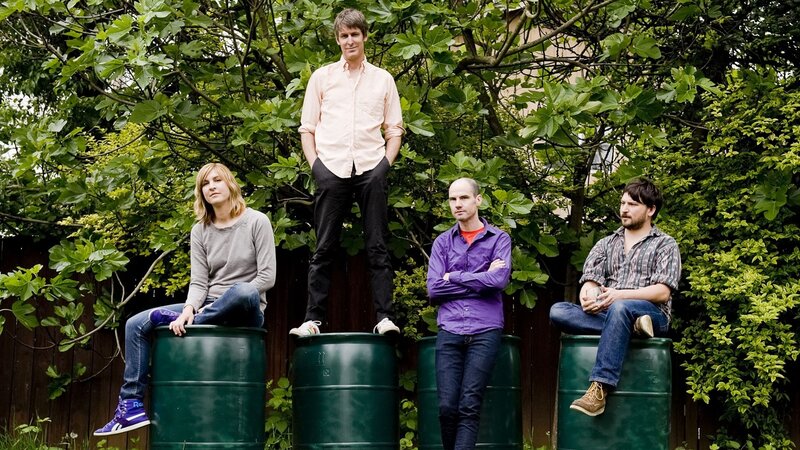band members on green barrels