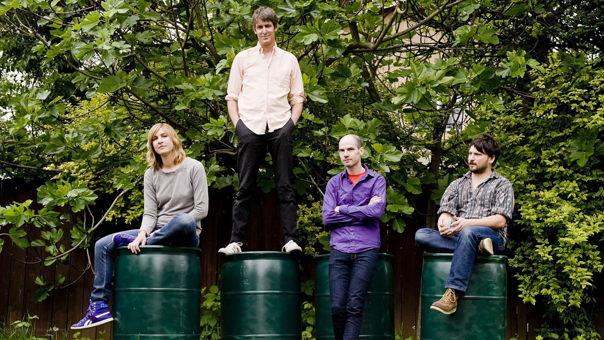 band members on green barrels