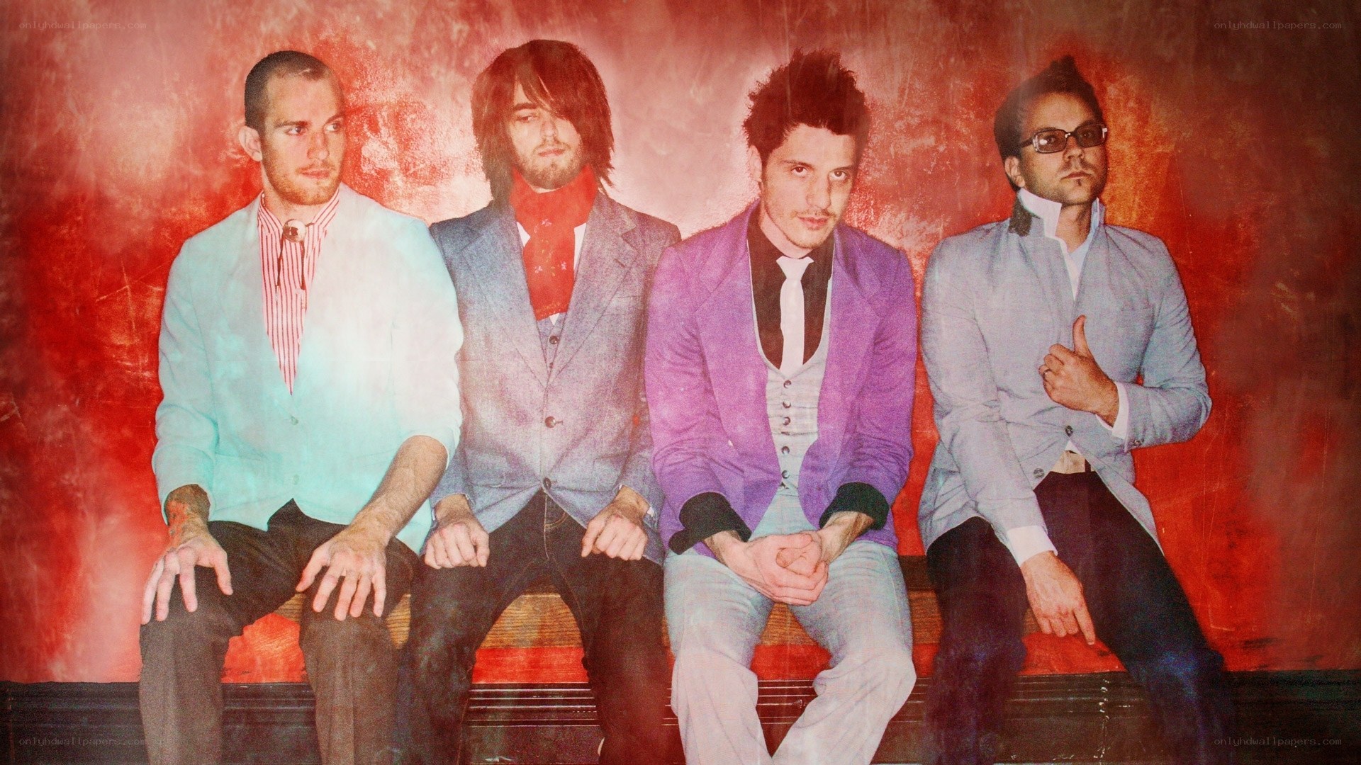 band members on red bench