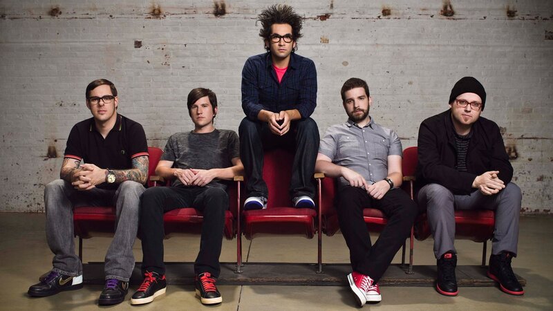 band members on red chairs
