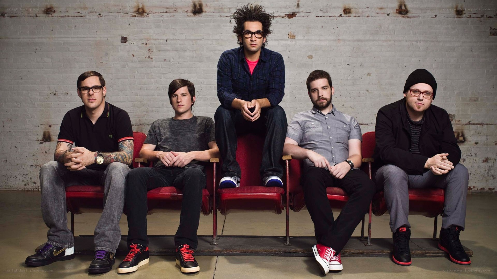 band members on red chairs