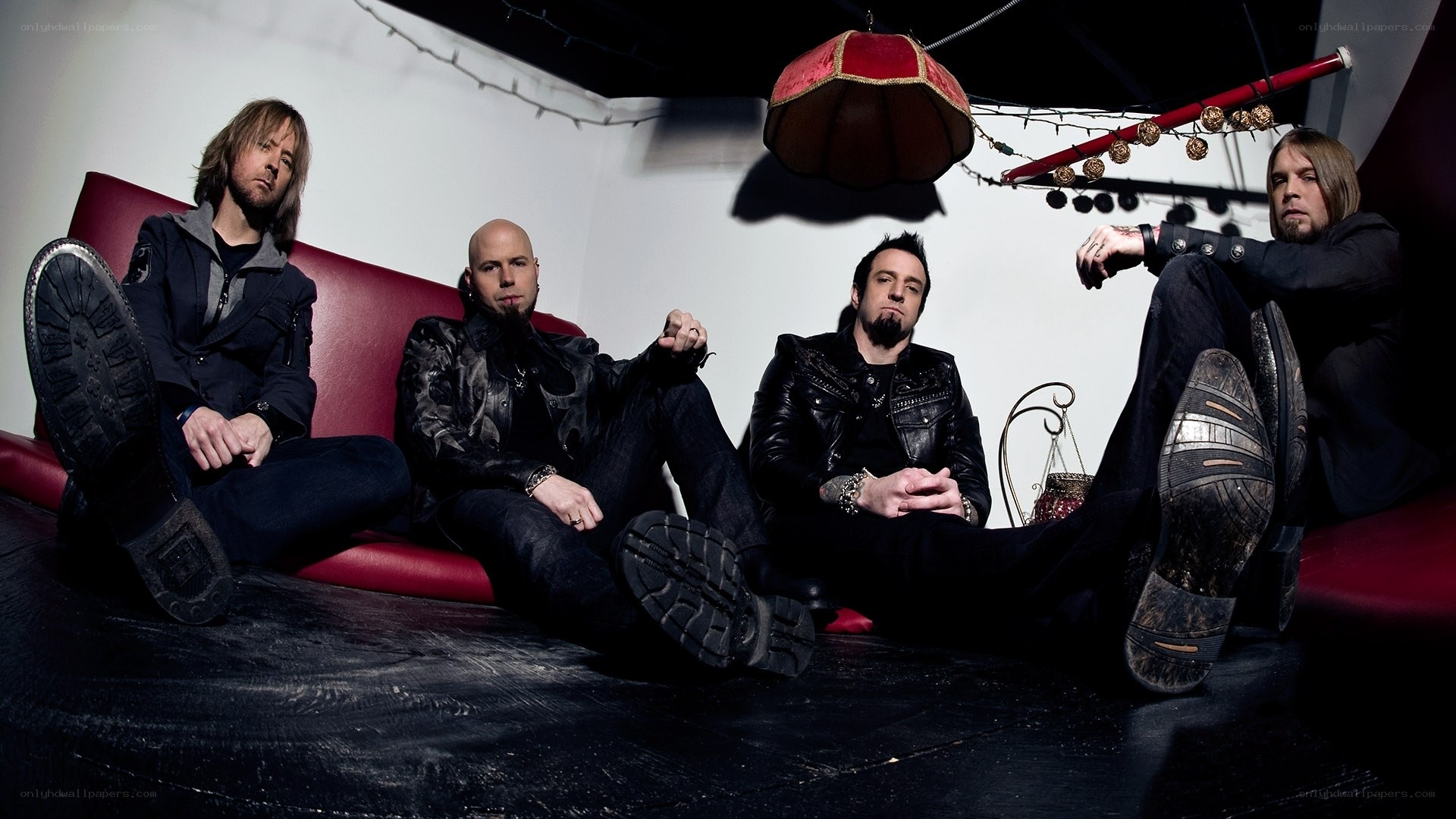 band members on red couch
