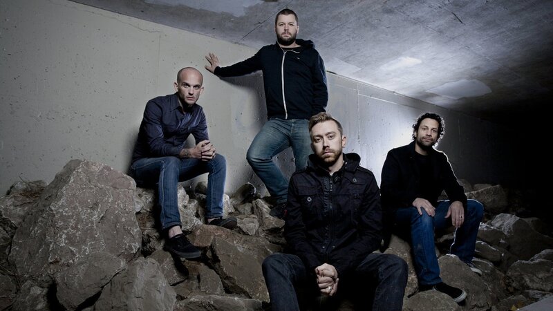 band members on rocks