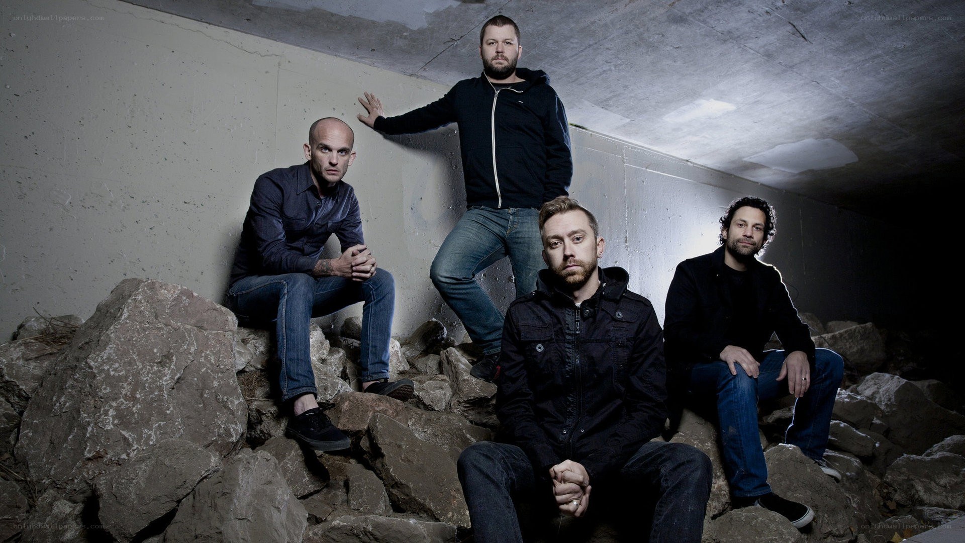 band members on rocks