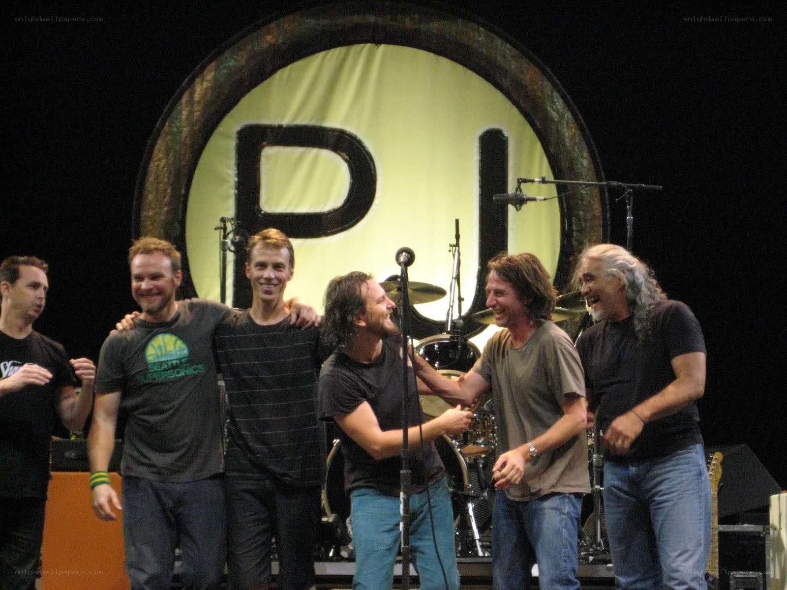 band members on stage together