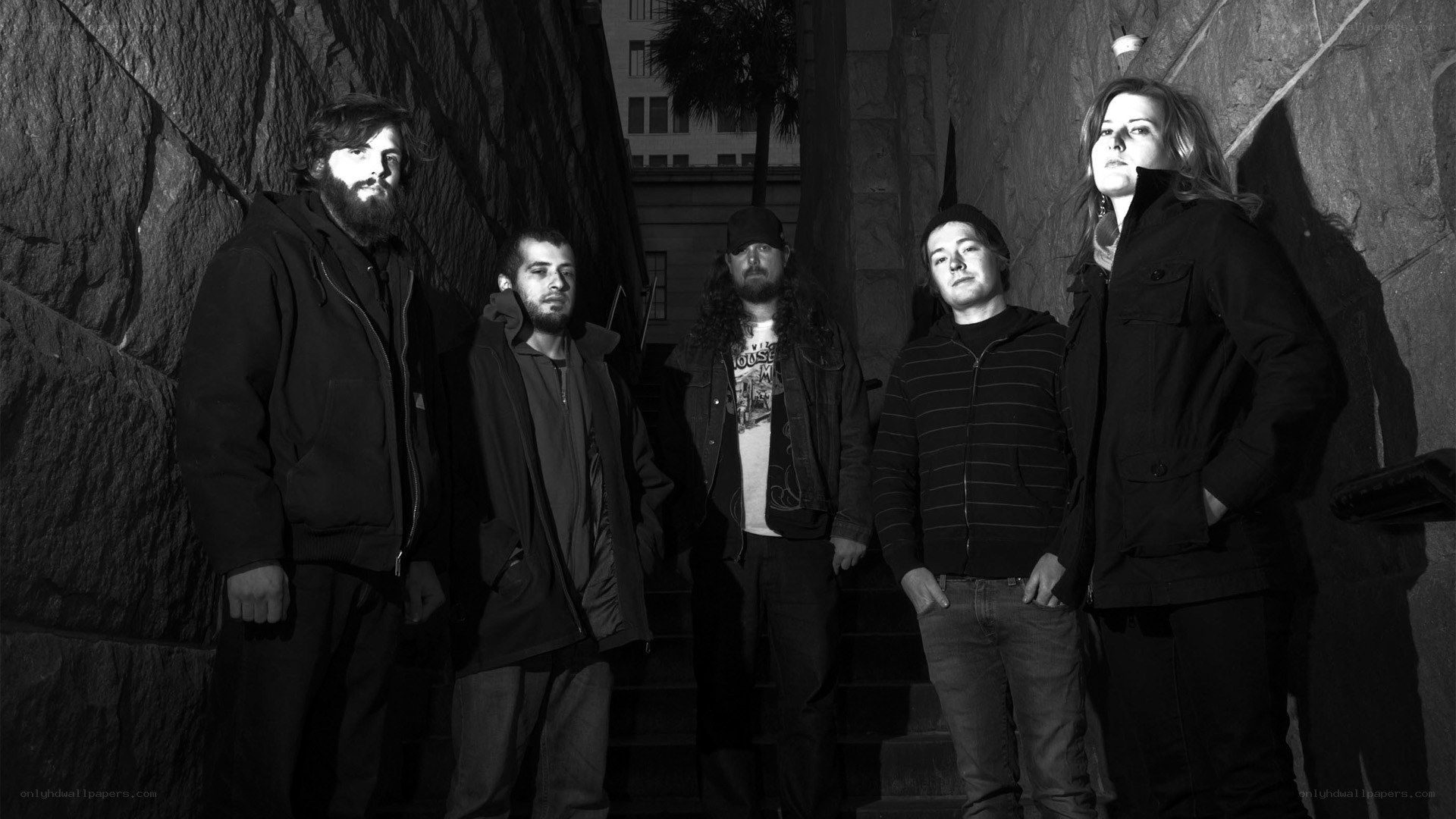 band members on stone steps