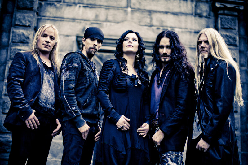 Band Members Posing — Black, Serious, Photograph, Stone Wall