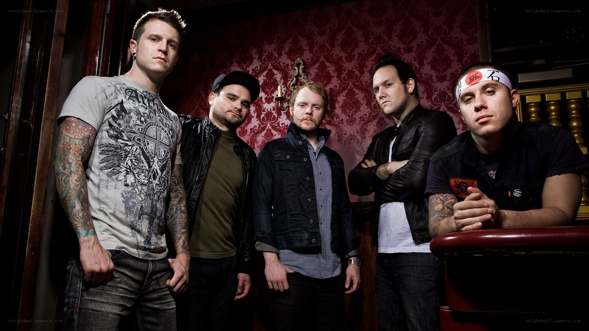 band members posing in a room