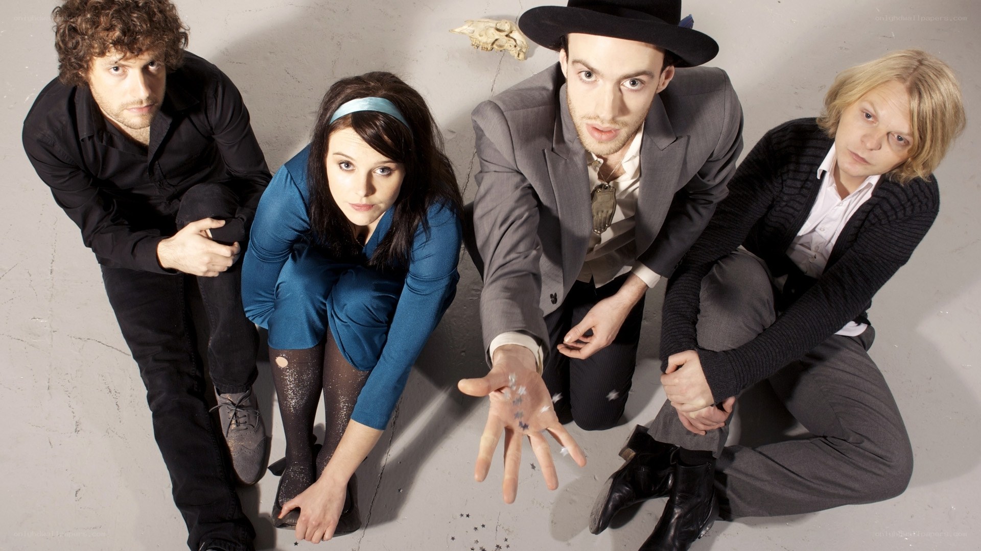 band members posing on floor