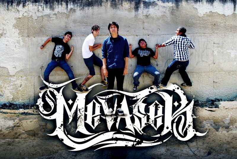 band members posing on wall