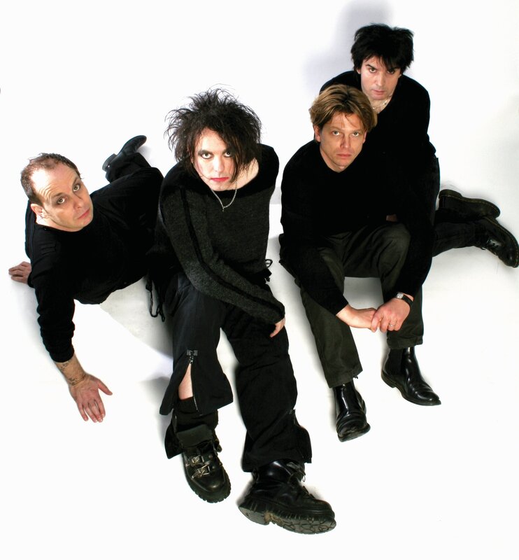 band members posing on white background