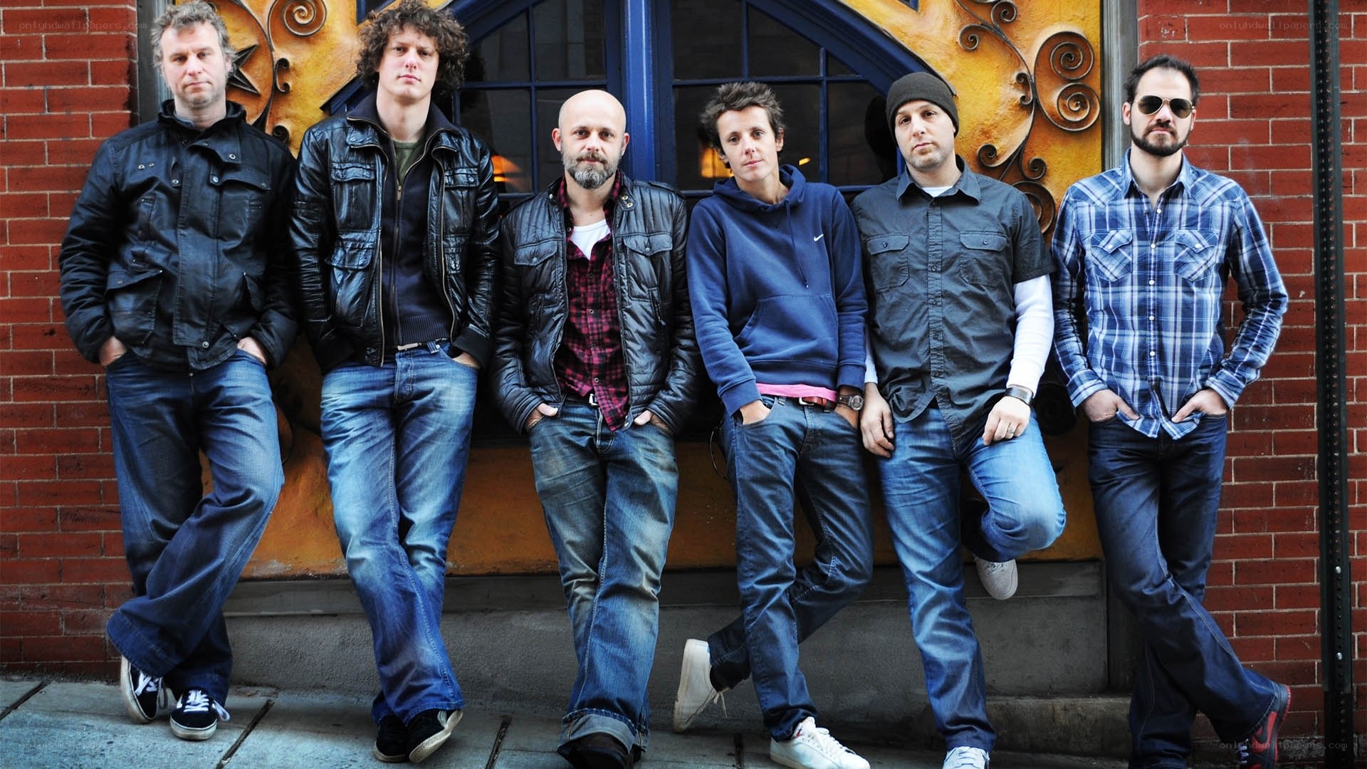 band members posing outside