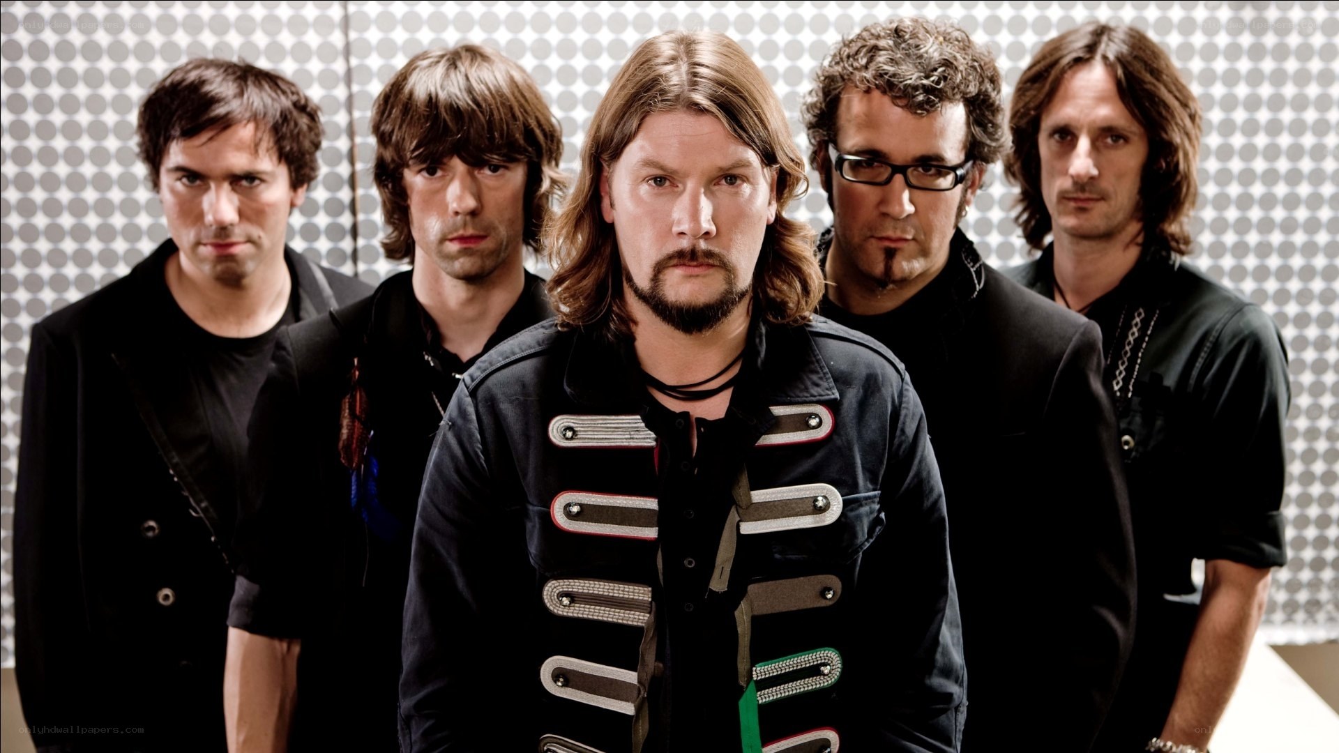 band members posing together