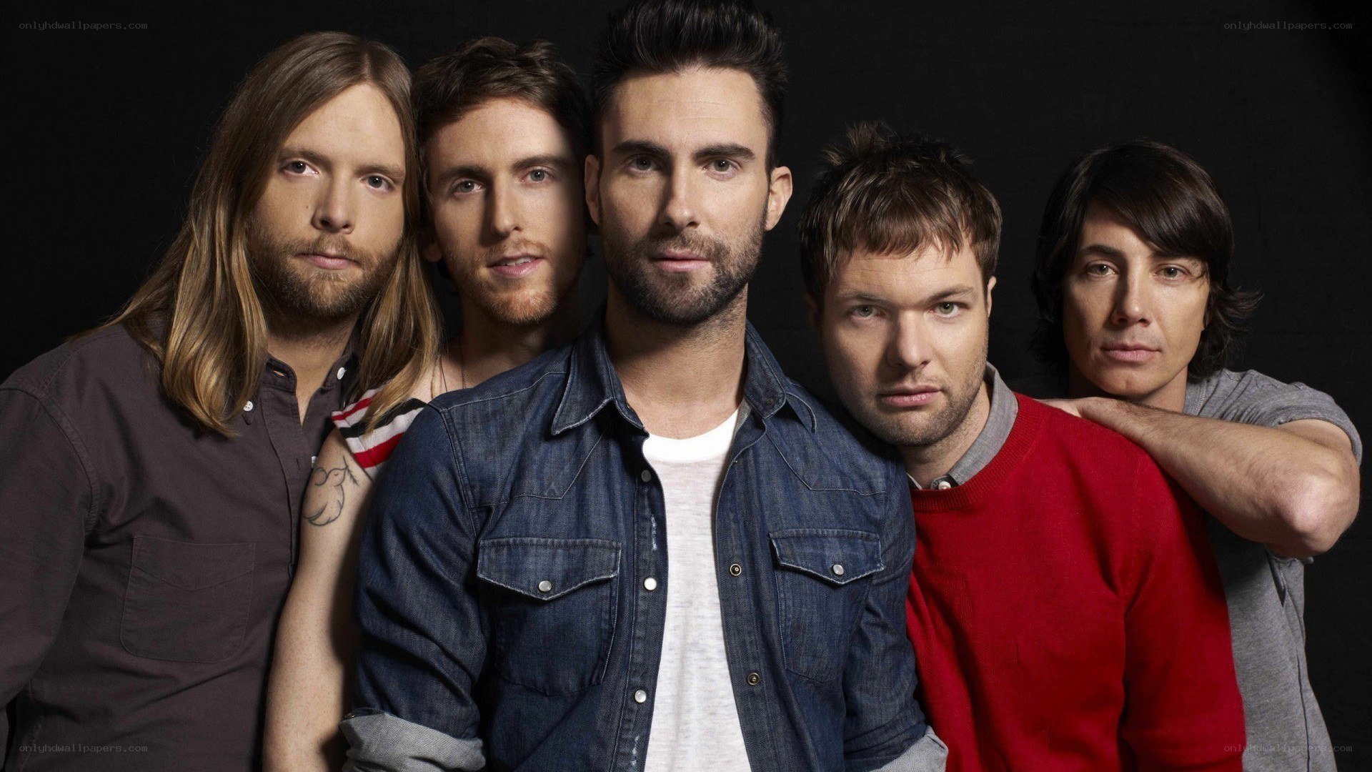 band members posing together