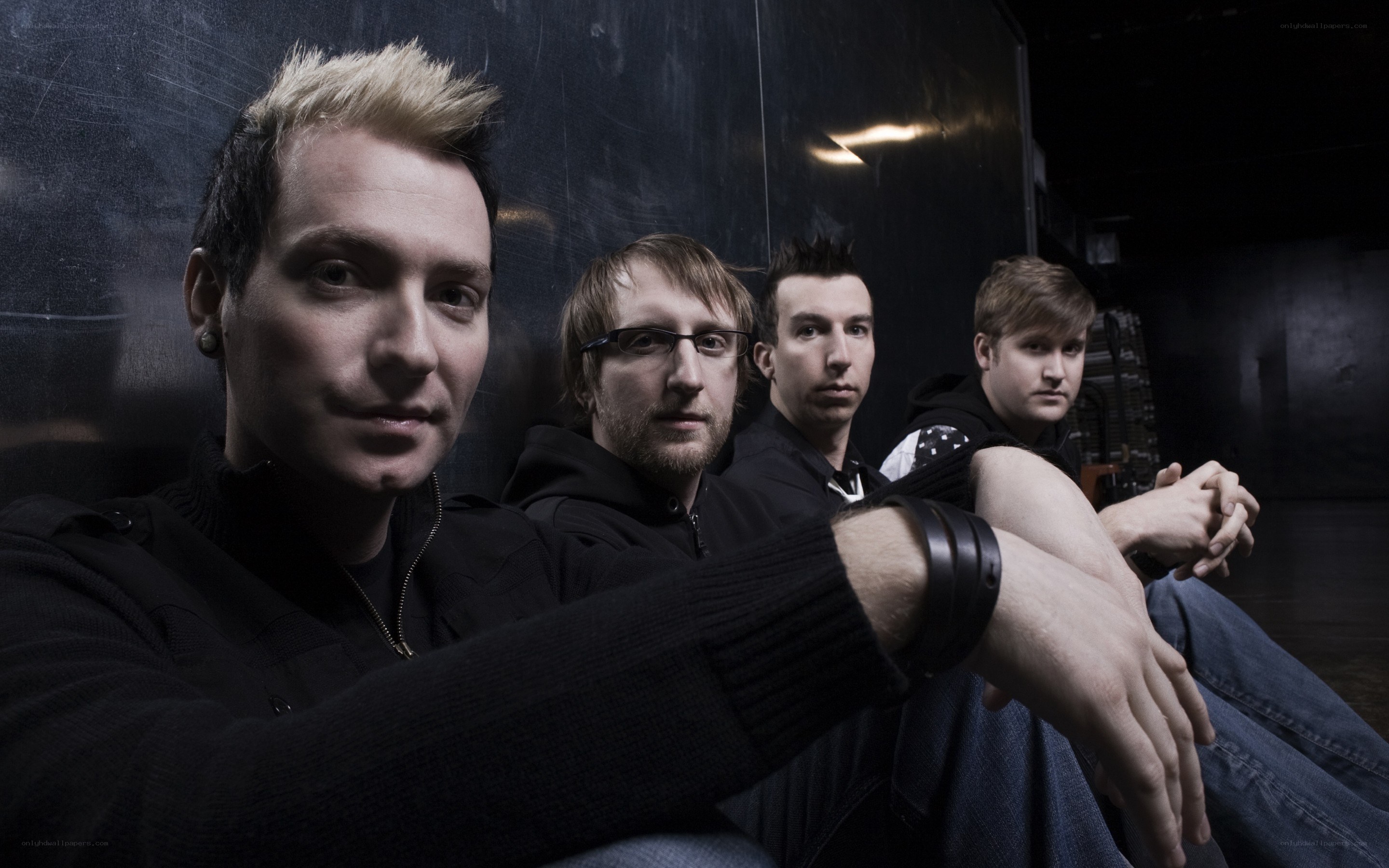 band members posing together