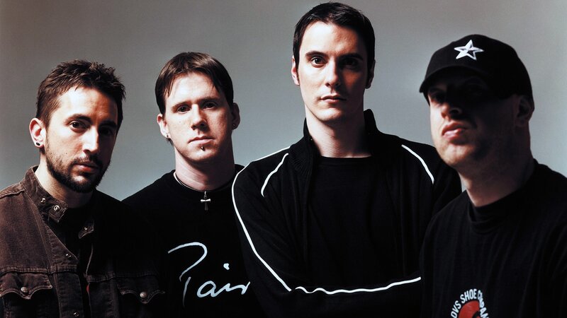 band members posing together