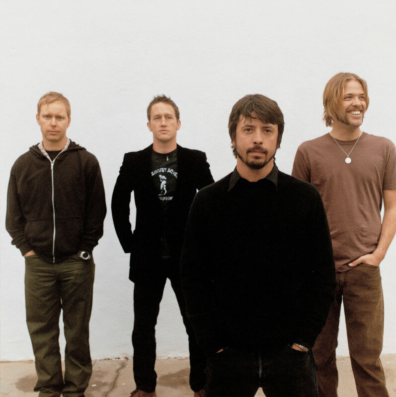 band members posing together