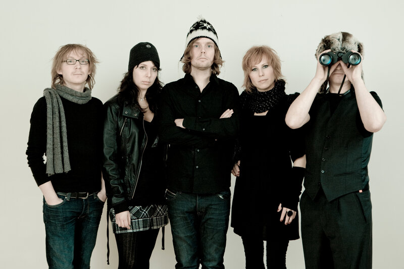 band members posing together