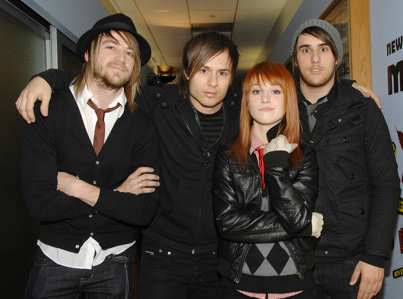 band members posing together