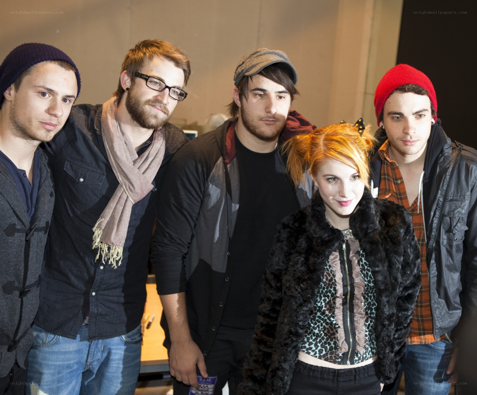 band members posing together