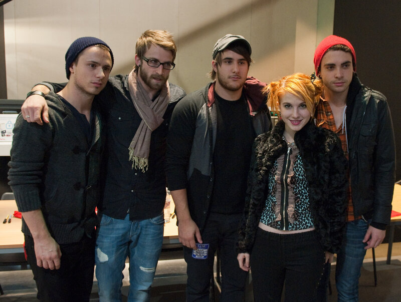 band members posing together