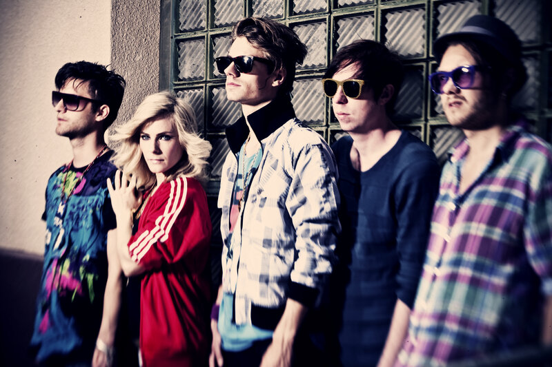 band members posing together
