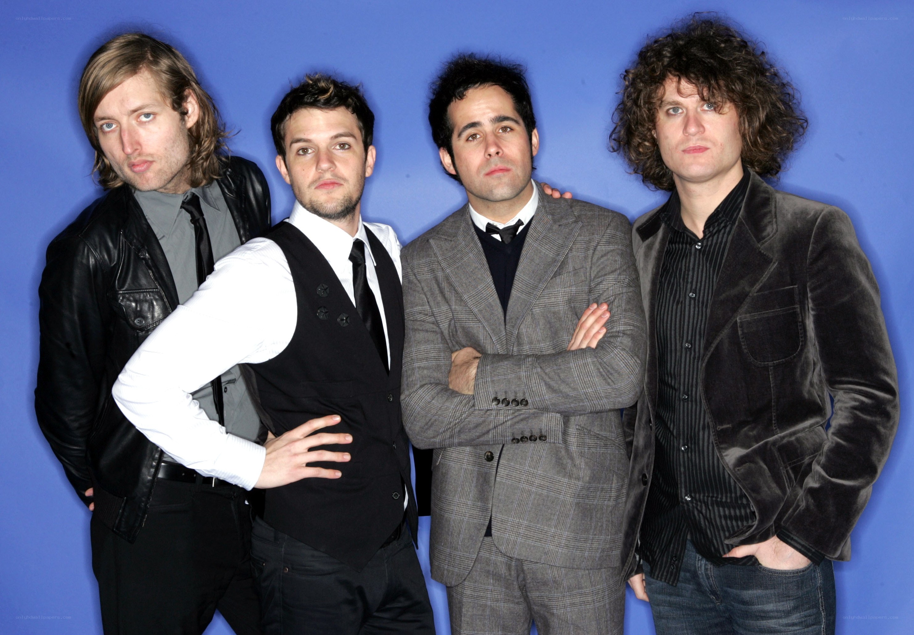 band members posing together