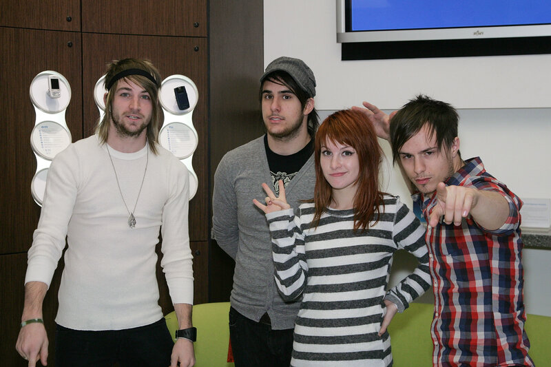 band members posing together