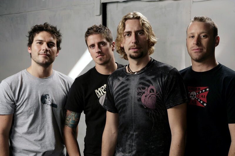 band members posing together