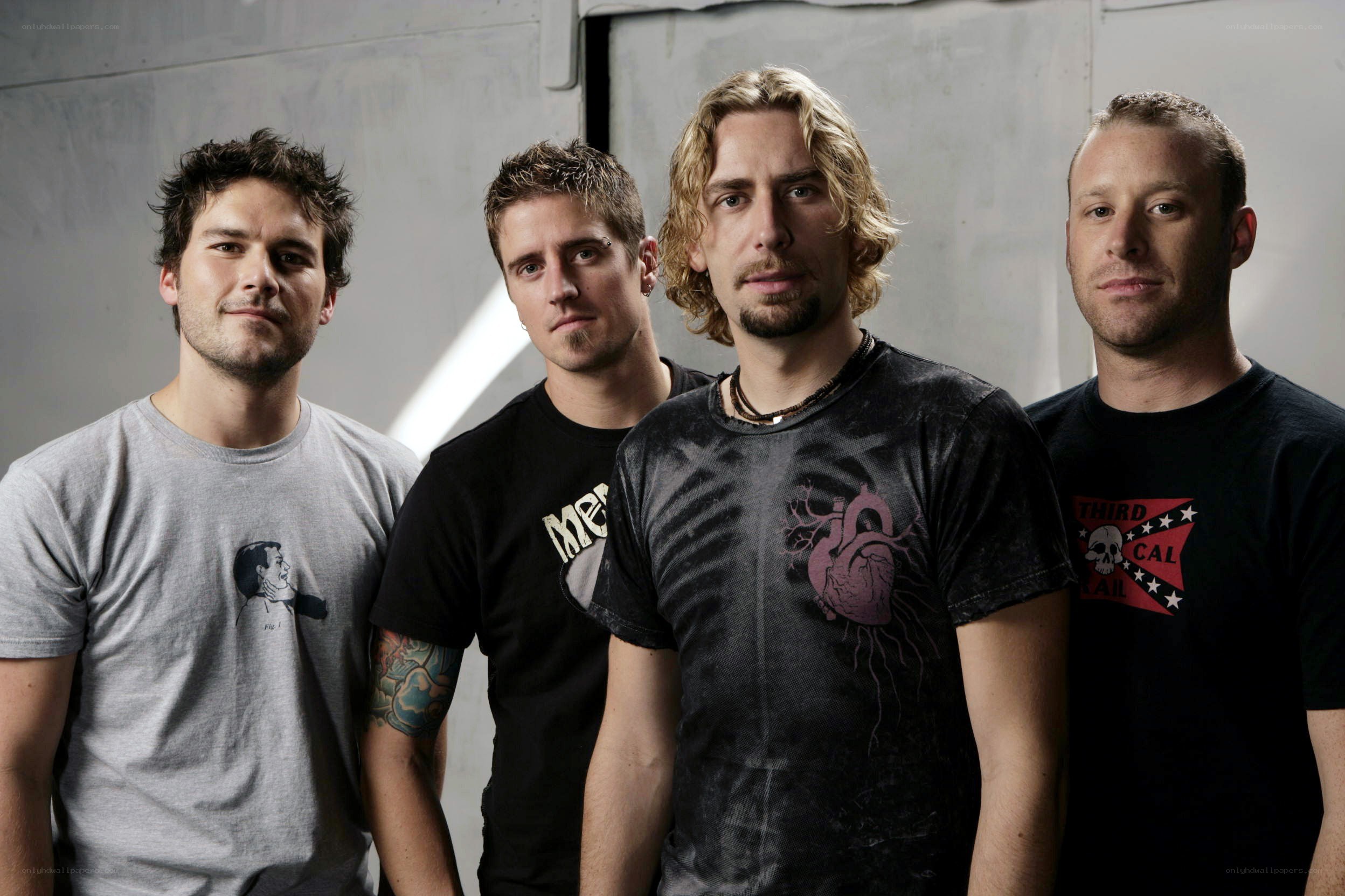 band members posing together