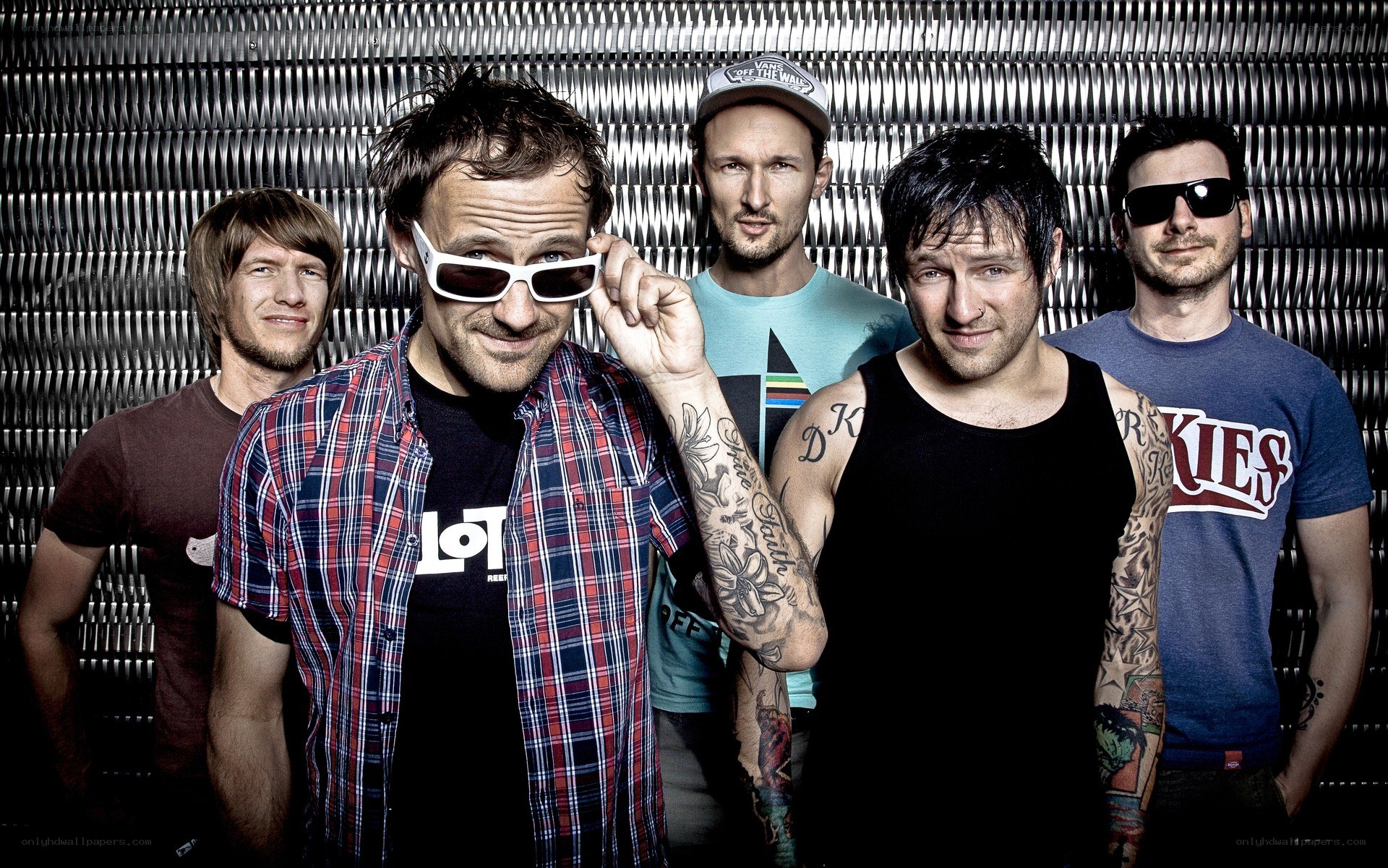 band members posing together