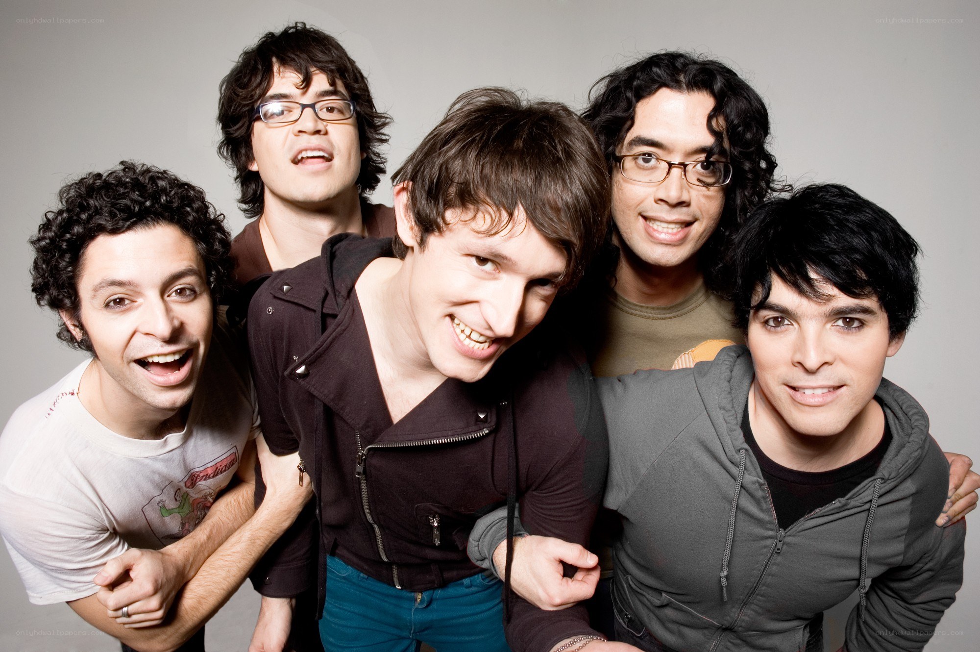 band members posing together
