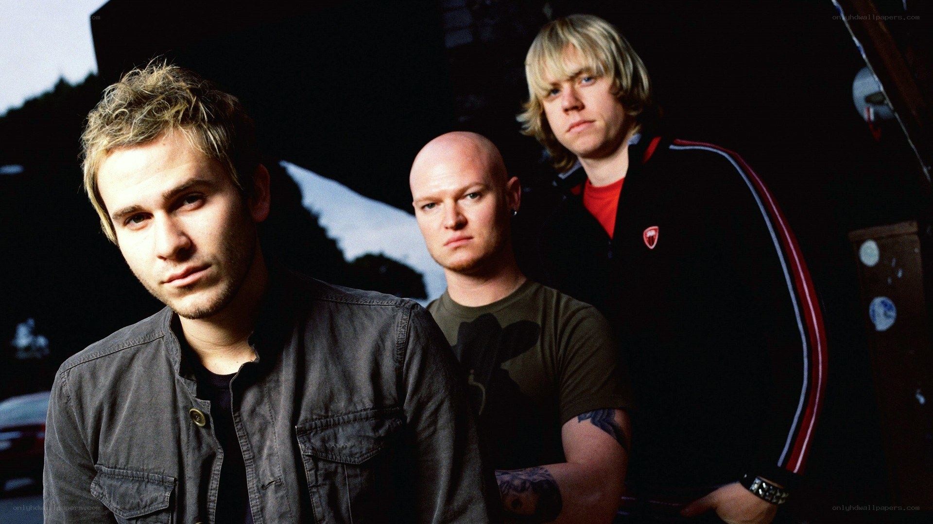 band members posing together