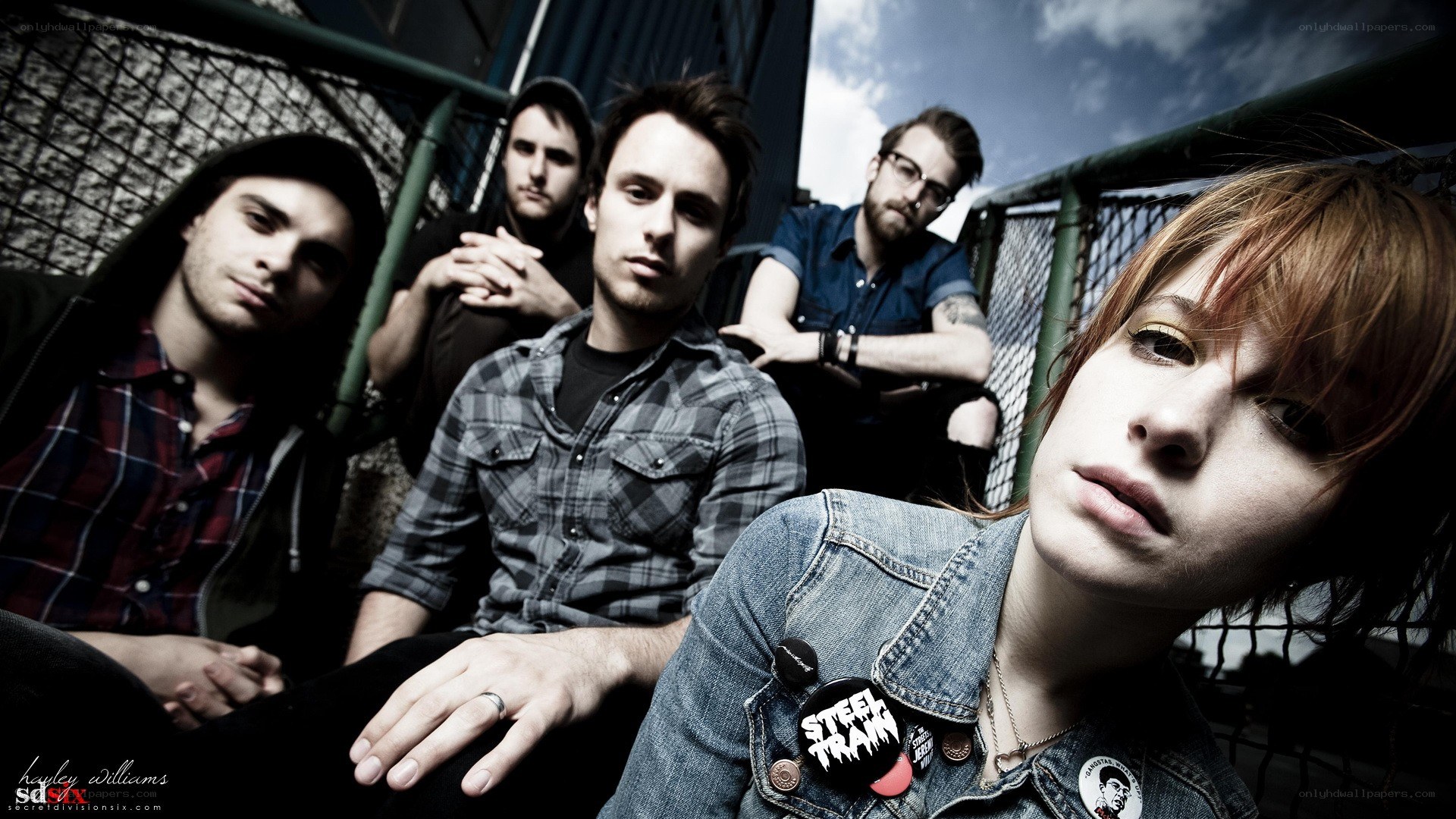band members posing together