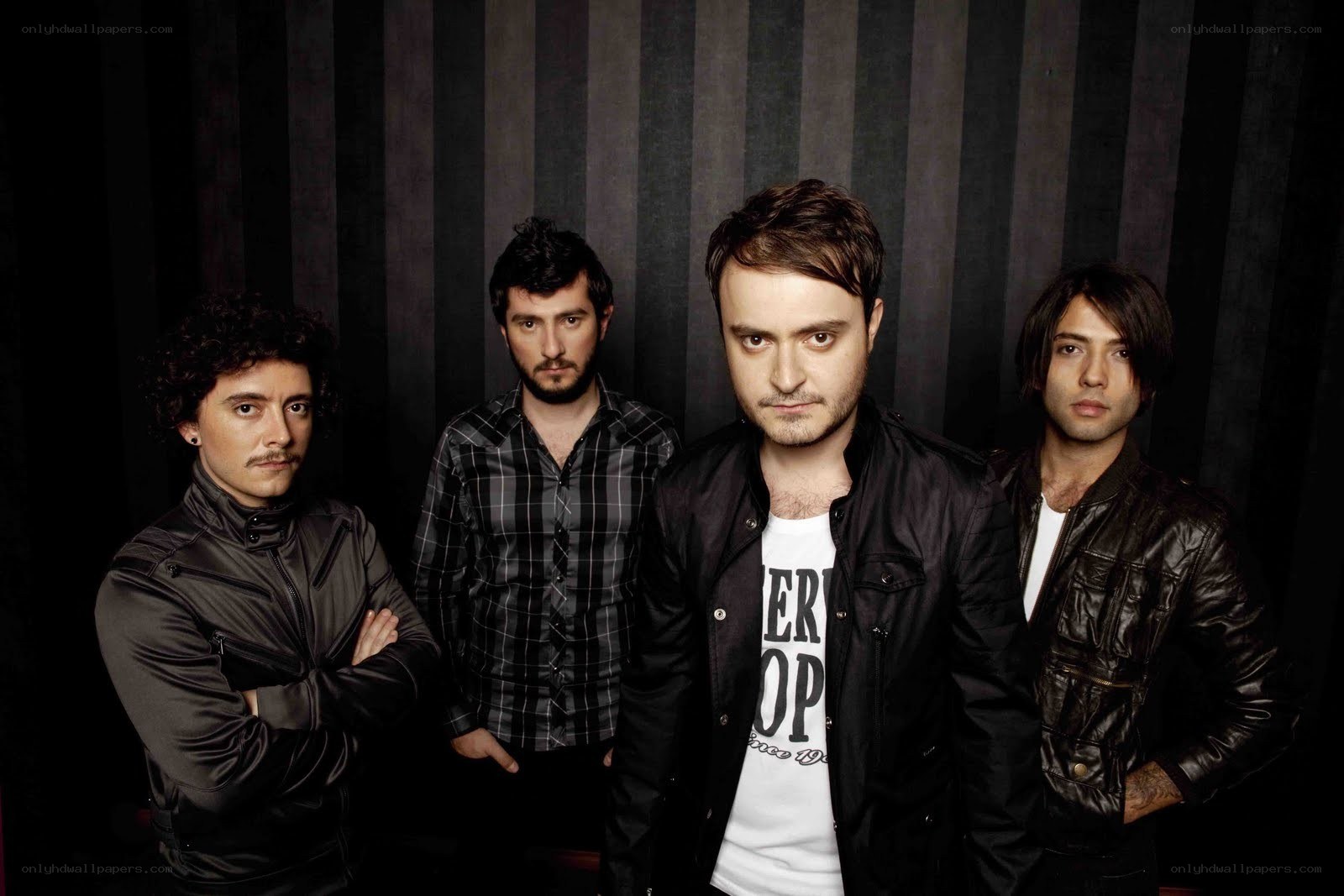 band members posing together