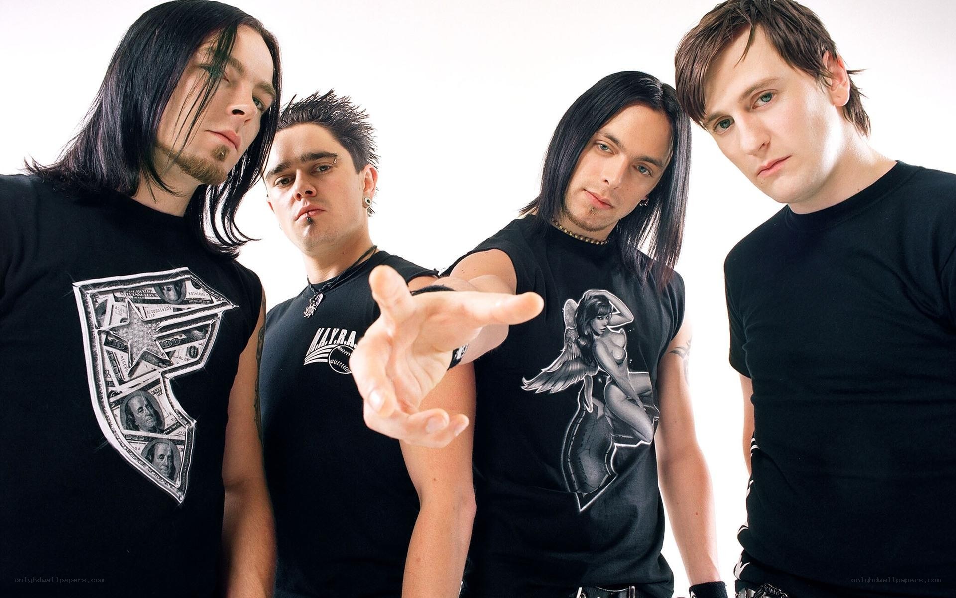 band members posing together